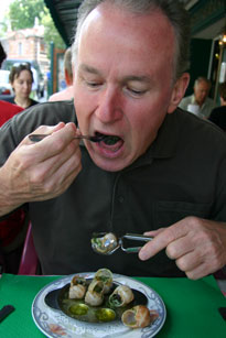 Epernay; Ross tucking into a plate of snails.